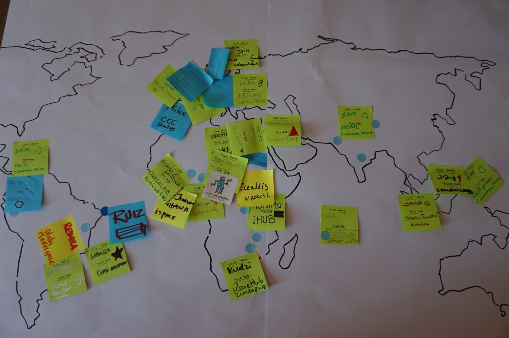 a hand-drawn map with stickies representing gig members' home locations